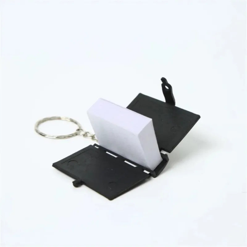 Keychain met mini notepad in zwarte beschermcase van Mini Koran